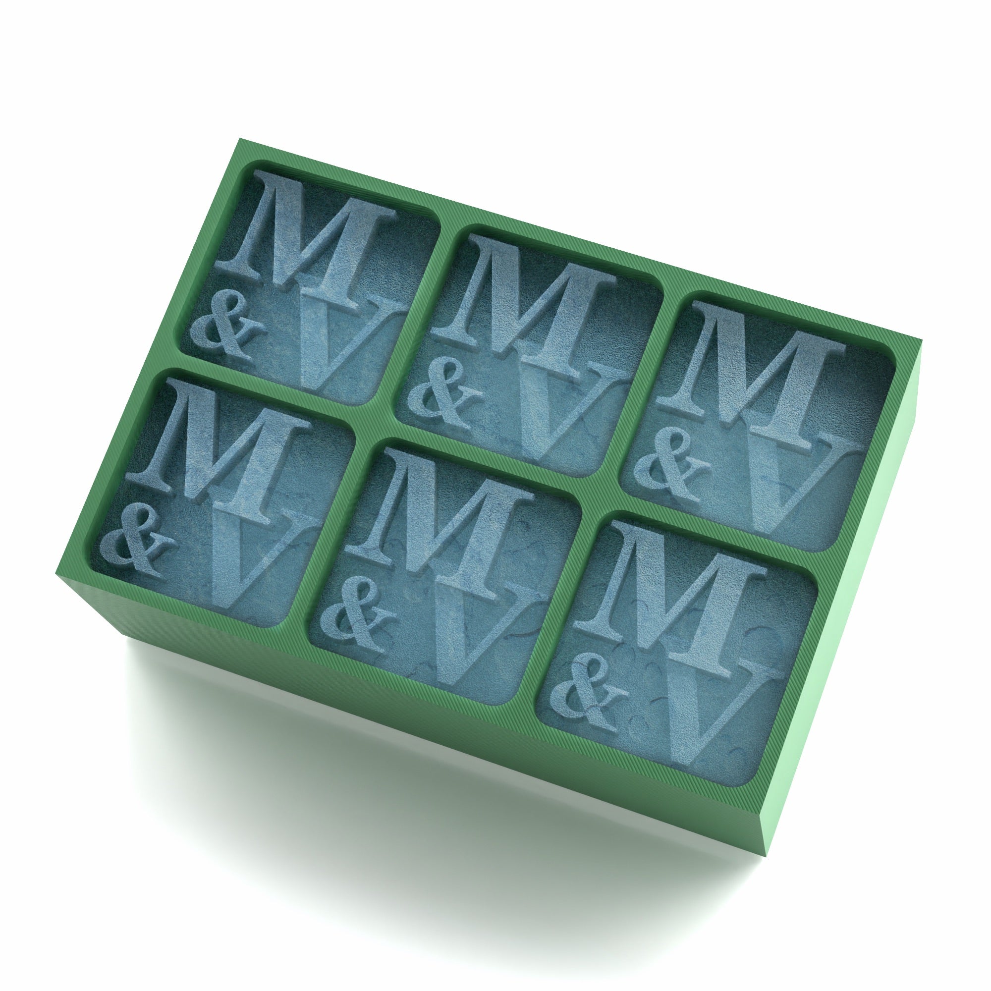 Soft green tray engraved with the initials M & V in every cube – a sentimental, sustainable gift idea for engagements, couples, or cocktail nights.