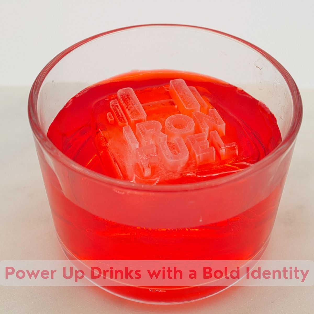 Red drink with raised Ice cube text for Iron Fuel, highlighting a bold and powerful brand identity