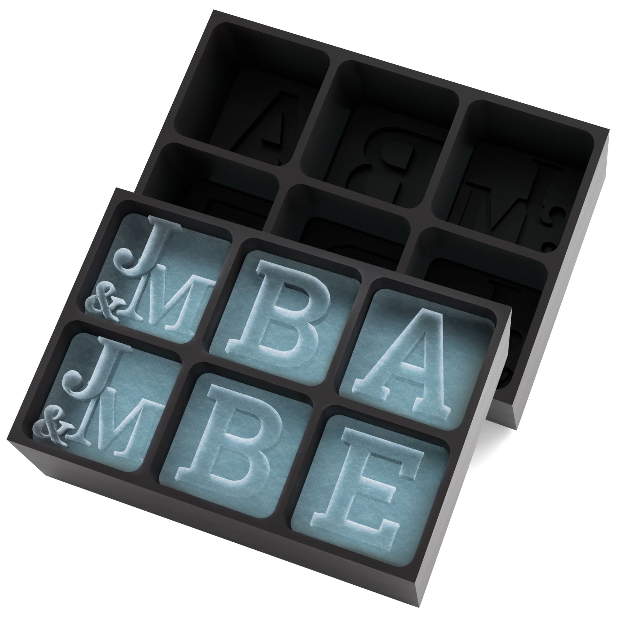 Black 6-cube silicone tray producing cubes engraved with JMBA monogram — personalised initials ice mould for gifts and branding.