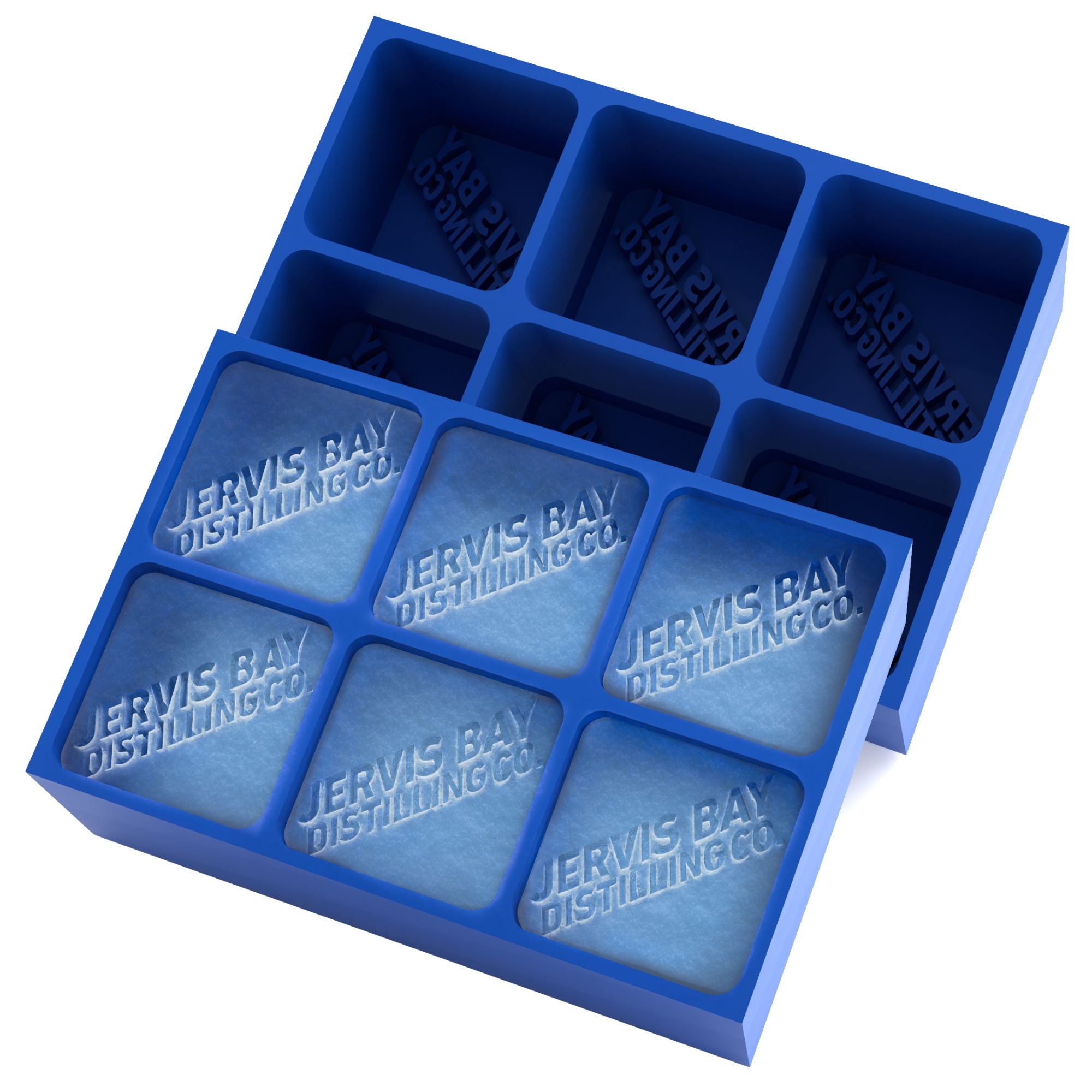 Royal-blue 6-cube silicone tray with Jervis Bay Distilling Co. logo frozen into square ice cubes — handmade promotional ice mould from Australia.