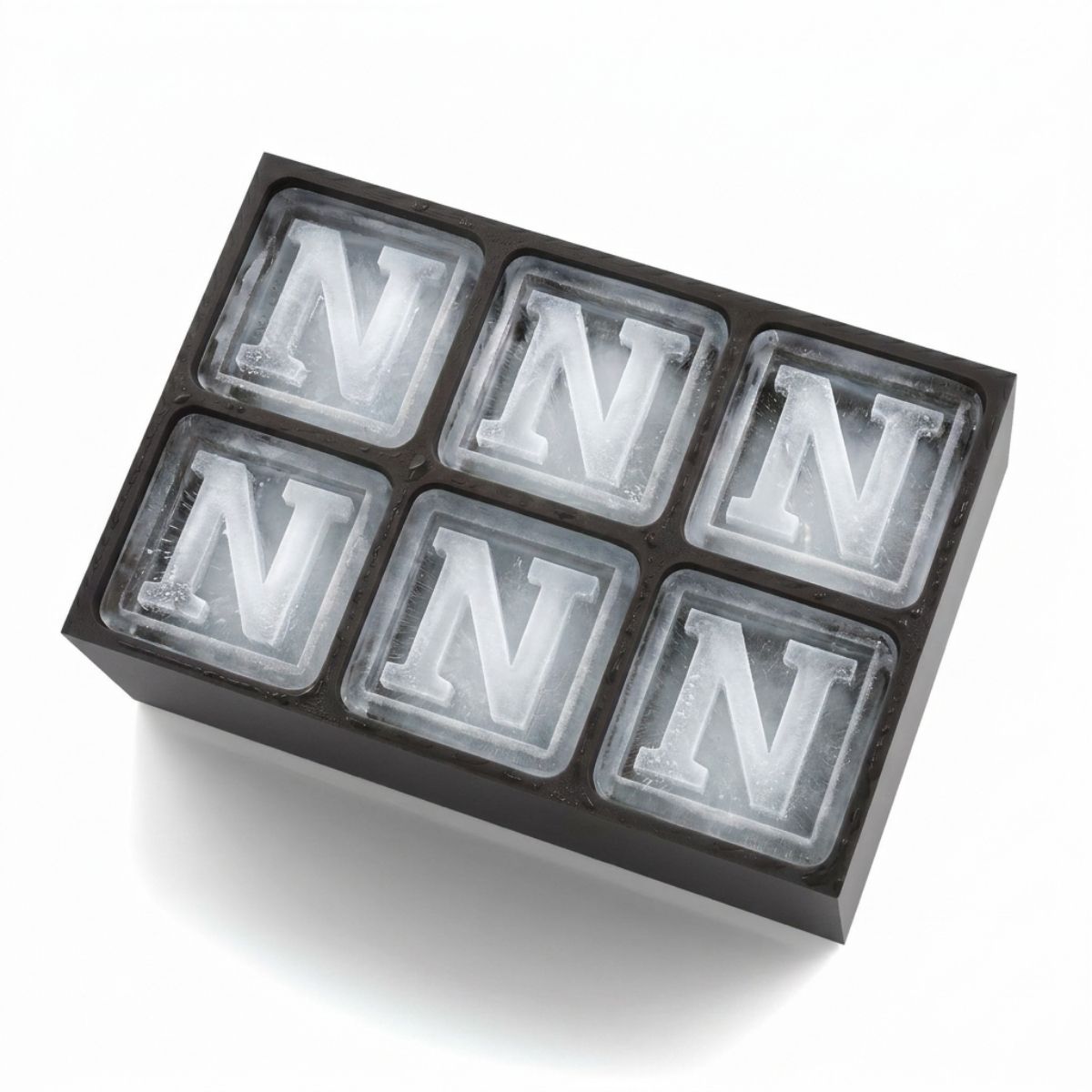 Black silicone ice tray with six frosted cubes, each featuring a raised letter N. Perfect personalised gift for milestone celebrations and parties.