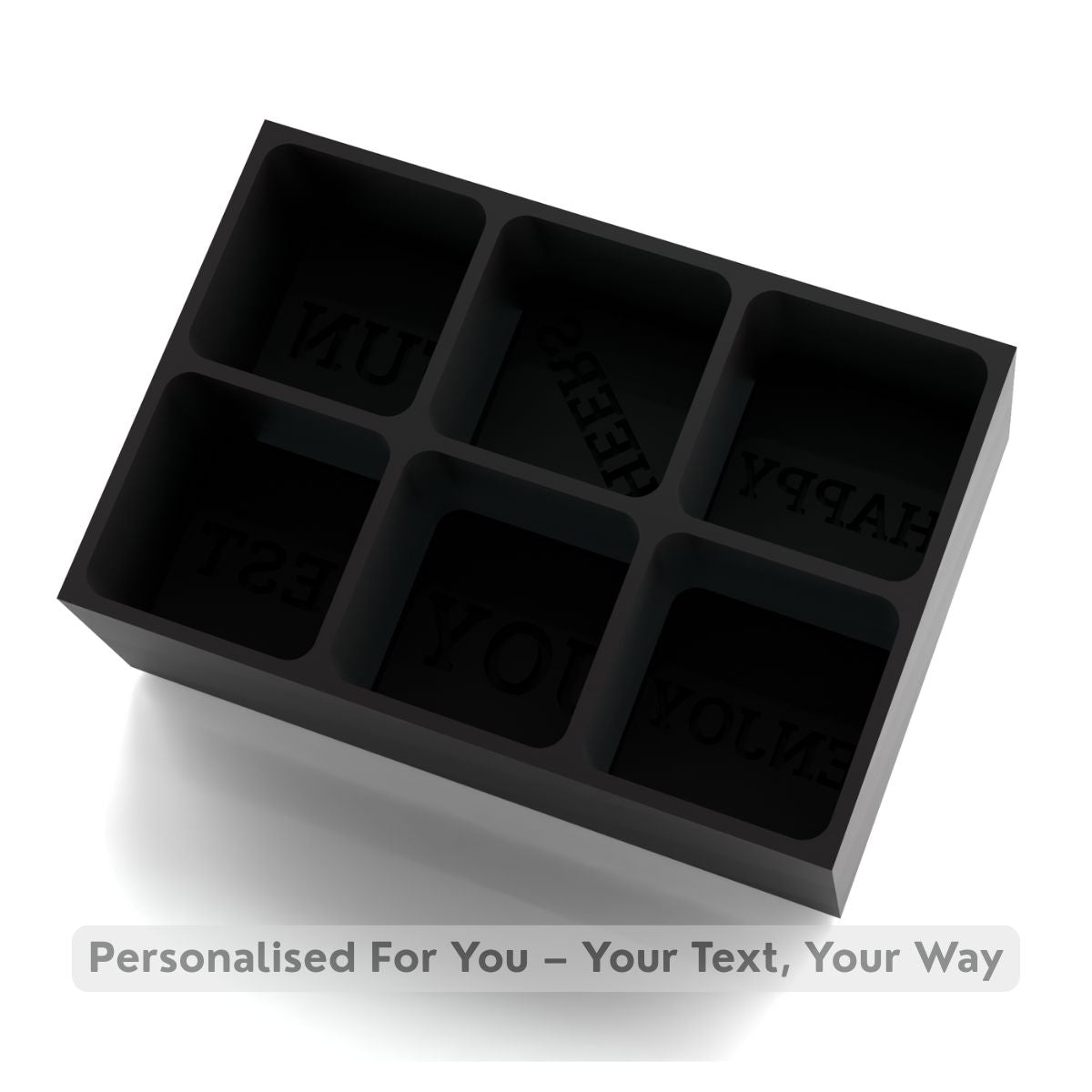 A matte black 6-cube silicone tray with customisable raised text cavities, perfect for a unique, thoughtful drink gift.