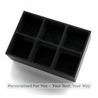 A matte black 6-cube silicone tray with customisable raised text cavities, perfect for a unique, thoughtful drink gift.