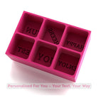 A bright pink silicone ice cube tray featuring custom message mould areas, adding fun and personality to drinks for birthdays, hens, and gifting.
