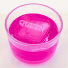 Pink ice cube with 'QUEEN' text on a white background