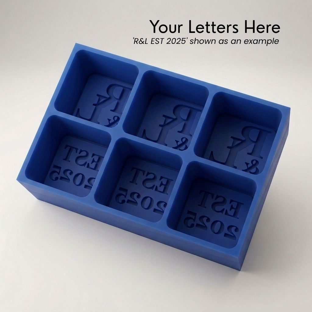 Royal blue R&L Est 2025 personalised silicone ice cube tray, top view of the monogram and EST 2025 embossed moulds