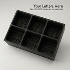 Charcoal grey R&L Est 2025 personalised silicone ice cube tray, top view of the monogram and EST 2025 embossed moulds