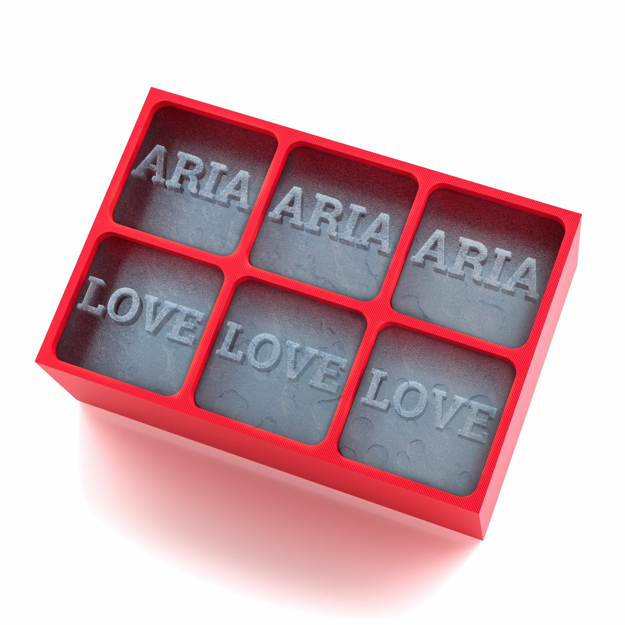 Vivid red ice tray featuring deeply etched ARIA and LOVE lettering in large, clear ice blocks.