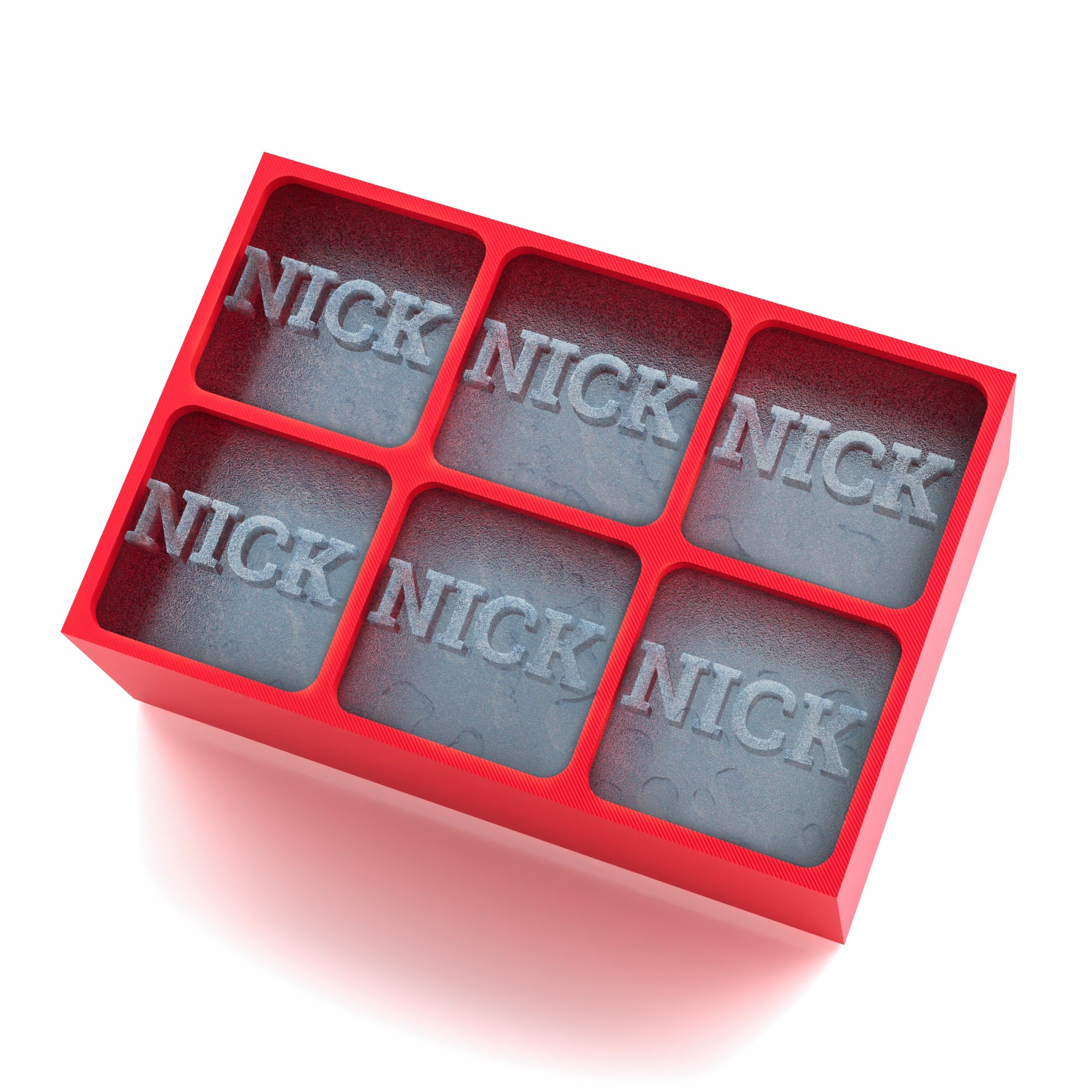 Bright red silicone tray making large NICK ice cubes, perfect for cocktails and whiskey
