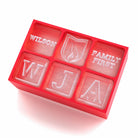 Red silicone ice tray with Wilson name, monogram cubes and family-first branding – personalised keepsake gift idea.