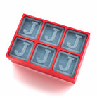 Bold red silicone ice tray moulds large J cubes, ideal for home bars, Father’s Day presents, and one-of-a-kind drink experiences.
