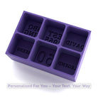 Rich-purple silicone tray casting six large cubes with engraved names or milestone numbers – great for anniversaries and cocktail nights.
