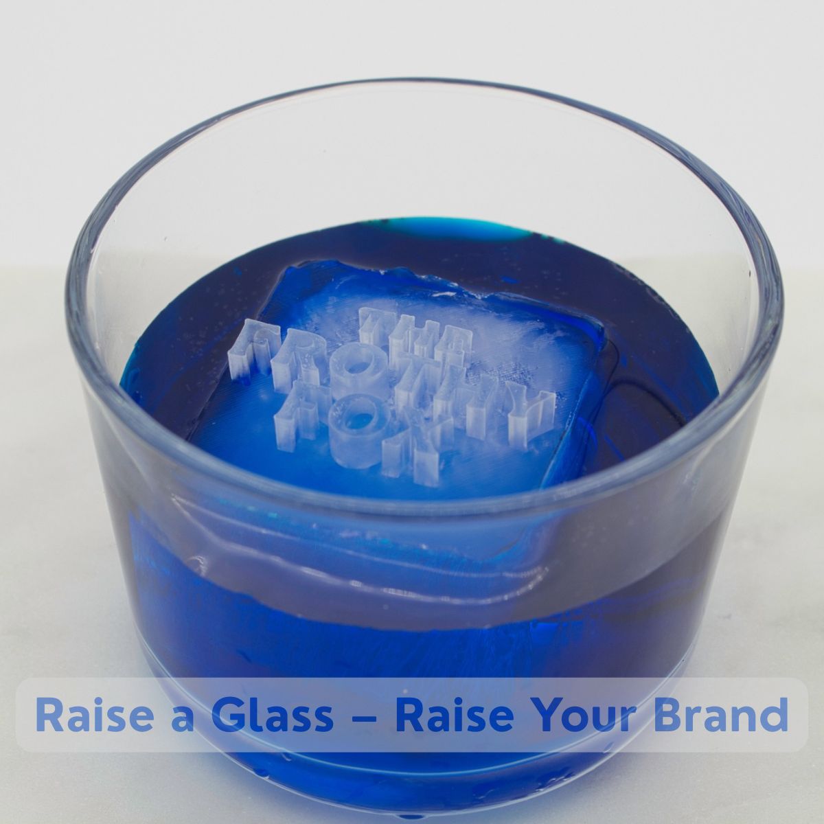 Bright blue drink with custom ice cube showing “The Frothy Fox” text logo, ideal for bars and pubs