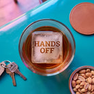 HANDS OFF etched ice cube in whisky