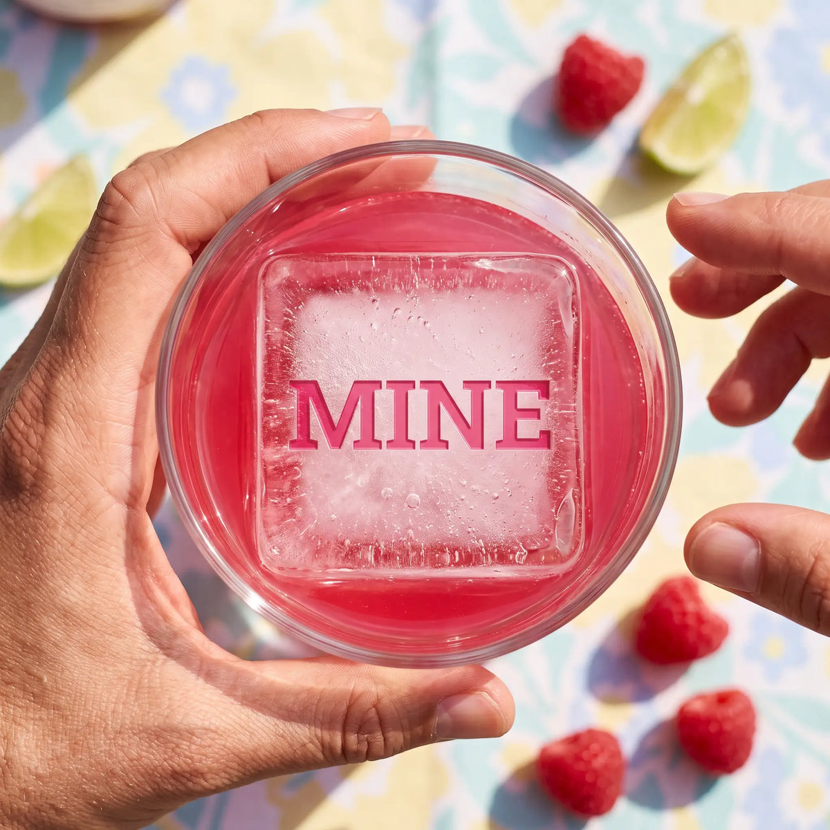 MINE etched ice cube in a raspberry gin and tonic
