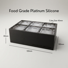 Black Letter M ice tray shown in its food-grade platinum silicone retail packaging
