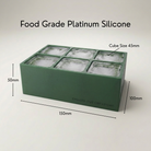 Green Letter M ice tray shown in its food-grade platinum silicone retail packaging