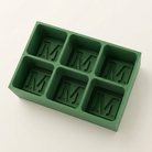 Green silicone Letter M ice cube tray, 6-cavity mould with bold monogram M design