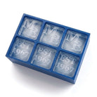 Blue monogrammed silicone ice cube tray filled with personalised initial and year ice cubes
