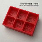 Red monogrammed silicone ice cube tray, personalised with custom initials and established year