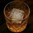 Personalised monogrammed ice cube featuring embossed initials in a glass of whiskey