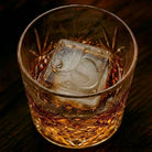 Custom monogrammed ice cube in a whiskey glass showing crisp embossed initials