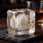 Close-up of a large monogrammed ice cube showing the EST year personalisation